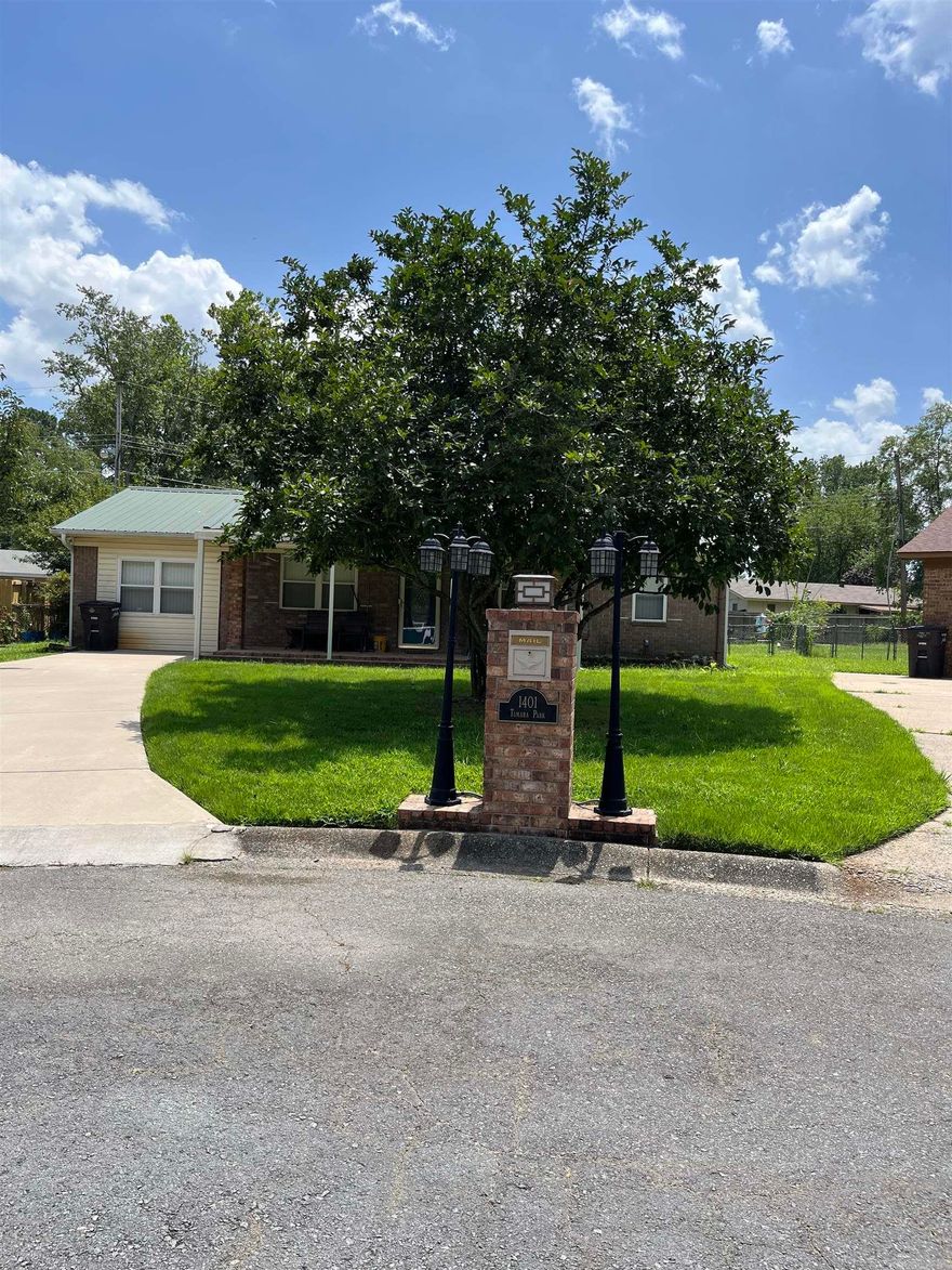 Discover your new home today! Beautiful inviting front porch to sit and sip your coffee in the morning time. Walk in to the large living room that is open to what would be a great game room plenty of space to put the pool table, even has a wet bar. 3bd/1.5 baths all tile flooring no carpet, very pet friendly. Ther is a covered back porch off the kitchen convenient for entertaining and grilling out. The HVAC is new, HWH replaced 2016 and the metal roof 2011. There is also an outside storage building to hold all your gardening and yard tools.