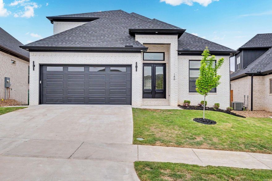 This stunning new-build home, thoughtfully crafted and move-in ready, delivers everything you need! Nestled in the desirable Fletcher Valley neighborhood, this two-story beauty boasts an all-brick exterior and an open floor plan with distinct living areas. Step into a grand entryway featuring custom details, elegant lighting, and soaring ceilings. The Pinterest-perfect kitchen dazzles with abundant cabinetry, premium appliances, a walk-in pantry, and a massive fridge included. The primary suite bathes in morning light—you'll never want to leave—complete with an oasis-like bathroom showcasing floor-to-ceiling tile, a freestanding tub, and an expansive walk-in closet. Upstairs, discover two additional bedrooms, plus attic access via the bonus room. But the real highlight is the covered back patio with its own fireplace, ideal for cozy evenings. Oversized sliding glass doors flow seamlessly from the kitchen to the patio, creating the ultimate entertaining space. With a community pool and park on the way, Fletcher Valley is a must-see!