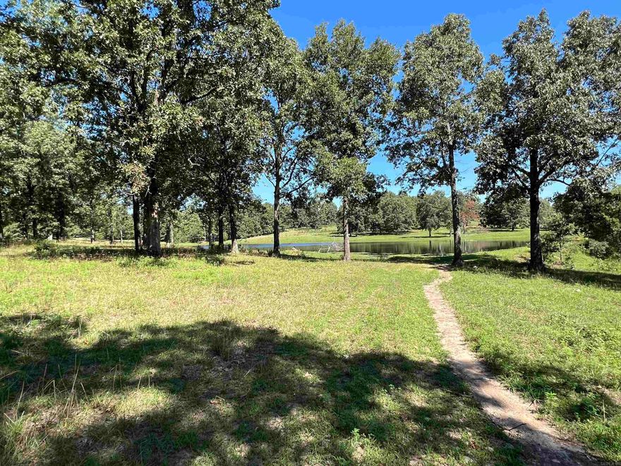 61 surveyed acres for sale with large 2 acre m/l stocked pond in Sharp County in North Arkansas. This recreational property is one not to be missed. Large, scattered oak trees, with the beautiful large pond / small lake gives this acreage a park - like feel. Deer and turkey abound on this property. Broker / owner has had trail cam pictures of multiple mature bucks. Perimeter fencing and water would allow for raising livestock. Property is mostly open pasture ground with scattered large oak trees, with some mature timber. Build your dream home overlooking the water on this magnificent property, or make a camping / hunting / fishing retreat that can be endlessly enjoyed for years to come. Owner/Broker