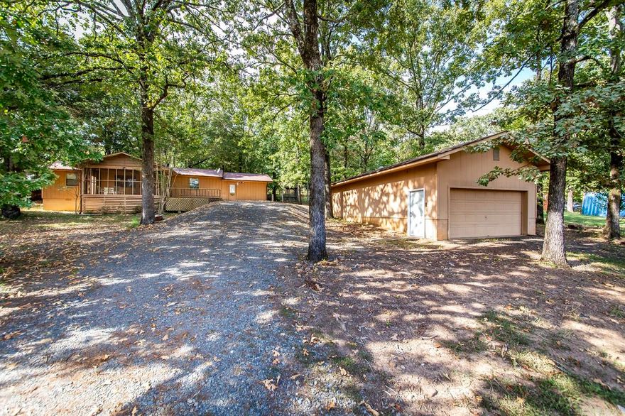 This charming 3-bedroom, 2-bathroom home is a dream for water enthusiasts, nestled just minutes away from Greers Ferry Lake. With its prime location, you'll have easy access to boating, fishing, and all the recreational activities the lake has to offer. The property also boasts a spacious shop, perfect for storing and maintaining your watercraft - it's large enough to comfortably accommodate two boats, making it a haven for any boating enthusiast. Whether you're looking for a year-round residence or a relaxing getaway, this home combines comfort and convenience, offering the ideal lakeside lifestyle.