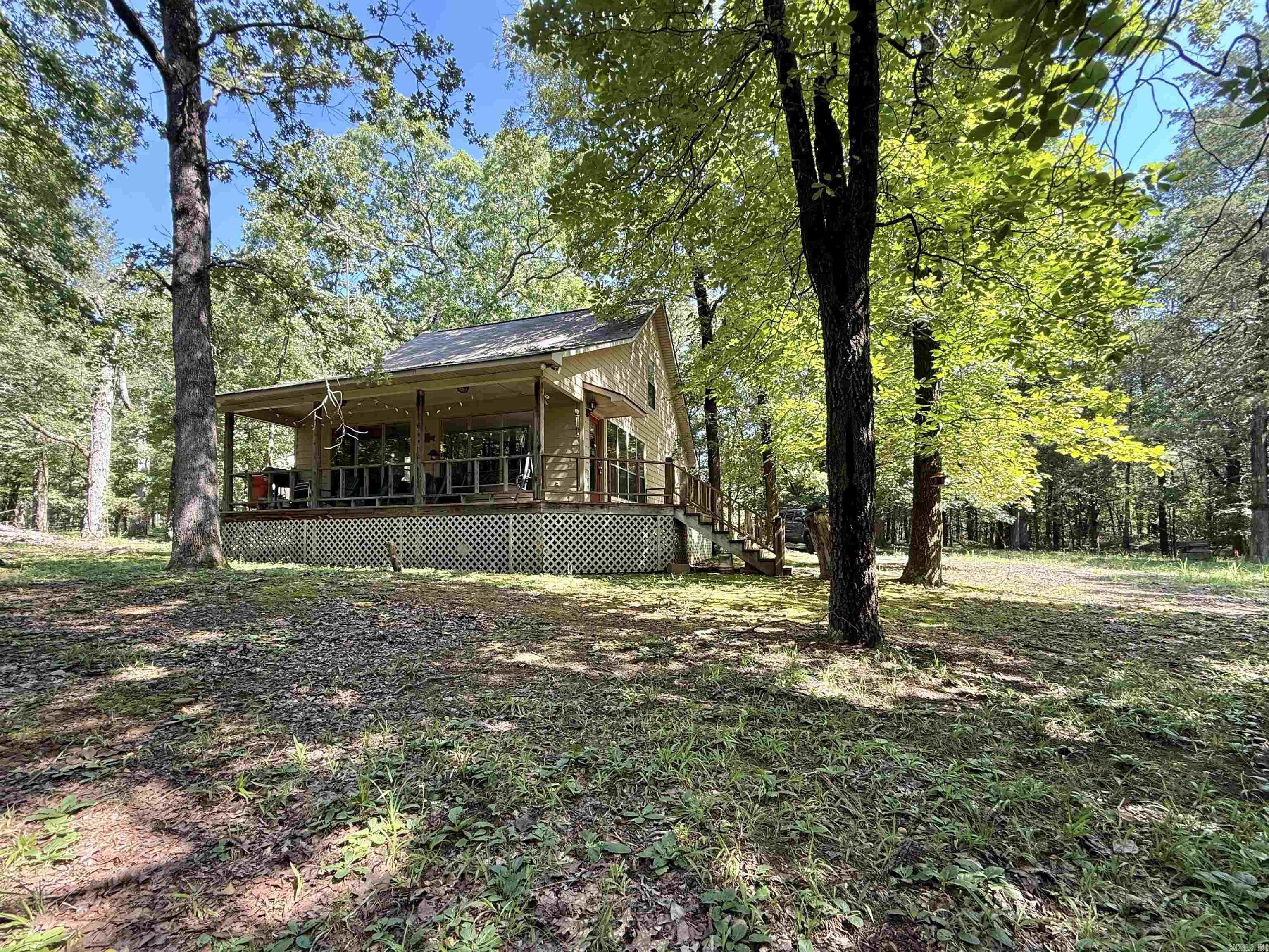 Lakefront Cabin in the woods , tucked away & backs up to the white line with a Corp. Approved Path Permit that takes you into Hurricane Bay Cove. Only 1.9 miles from Shiloh Marina. Great Fishing spot & great cove to tie up your friends boats and relax on your float. The sellers are the orginal owners & had the house built in 2000 for their family. It has been a great weekend cabin for them & they hope the new owners get as much joy and memories out of the home as they have. Most furnishings & dish-ware can stay (a few personal items sellers will take). All appliances stay. Exterior is Hardie Board & they used a heavy duty Sherwin Williams paint (2 coats) so they have never had to repaint the siding since they've owned. This property has been well taken care of. ADT Alarm, New Roof by Mayfield Construction in 2018. See New Survey online under "docs"