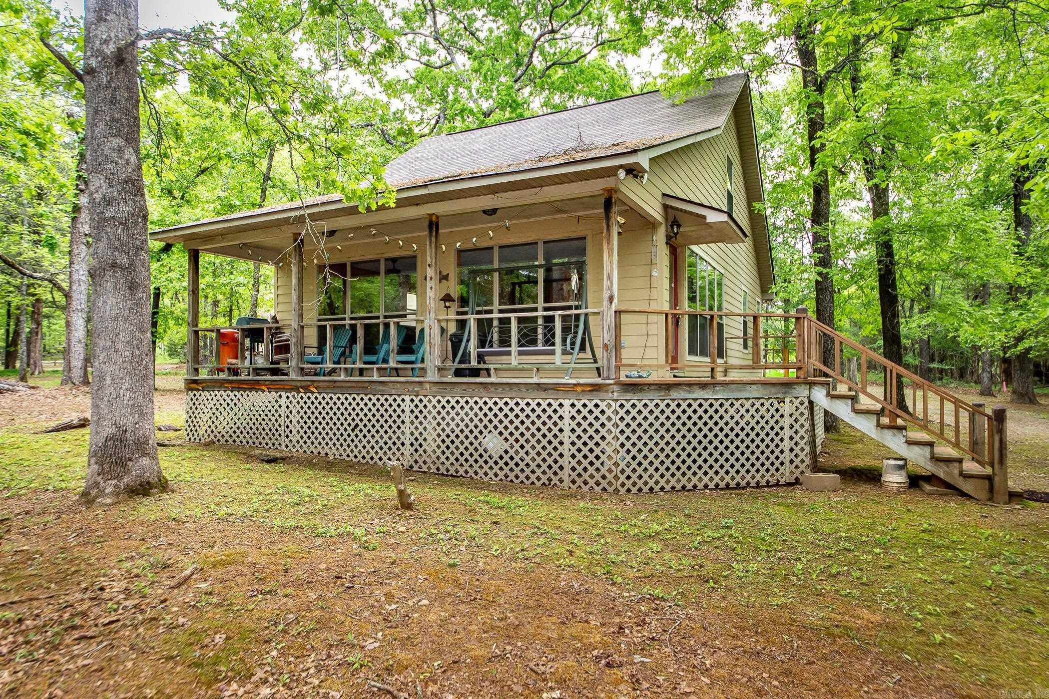 Lakefront Cabin in the woods , tucked away & backs up to the white line with a Corp. Approved Path Permit that takes you into Hurricane Bay Cove. Only 1.9 miles from Shiloh Marina. Great Fishing spot & great cove to tie up your friends boats and relax on your float. The sellers are the orginal owners & had the house built in 2000 for their family. It has been a great weekend cabin for them & they hope the new owners get as much joy and memories out of the home as they have. Most furnishings & dish-ware can stay (a few personal items sellers will take). All appliances stay. Exterior is Hardie Board & they used a heavy duty Sherwin Williams paint (2 coats) so they have never had to repaint the siding since they've owned. This property has been well taken care of. ADT Alarm, New Roof by Mayfield Construction in 2018. See New Survey online under "docs"