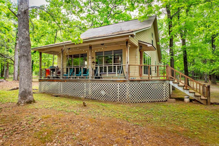 Lakefront Cabin in the woods , tucked away & backs up to the white line with a Corp. Approved Path Permit that takes you into Hurricane Bay Cove. Only 1.9 miles from Shiloh Marina. Great Fishing spot & great cove to tie up your friends boats and relax on your float. The sellers are the orginal owners & had the house built in 2000 for their family. It has been a great weekend cabin for them & they hope the new owners get as much joy and memories out of the home as they have.  Most furnishings & dish-ware can stay (a few personal items sellers will take). All appliances stay. Exterior is Hardie Board & they used a heavy duty Sherwin Williams paint (2 coats) so they have never had to repaint the siding since they've owned.  This property has been well taken care of. ADT Alarm, New Roof by Mayfield Construction in 2018. See New Survey online under "docs"