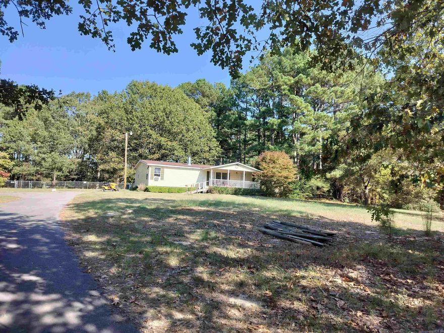 The perfect homestead! 3.2 mostly cleared acres with mature trees, all utilities in place, fencing and asphalt driveway. One of the highest spots in the area, yet with a level yard. 1995 MH, conveyed at no value, has had water damage and needs new flooring and kitchen but could be repaired or easily replaced or build your dream house! Sheridan SD but the Bryant SD boundary is at the property line so a transfer is available.