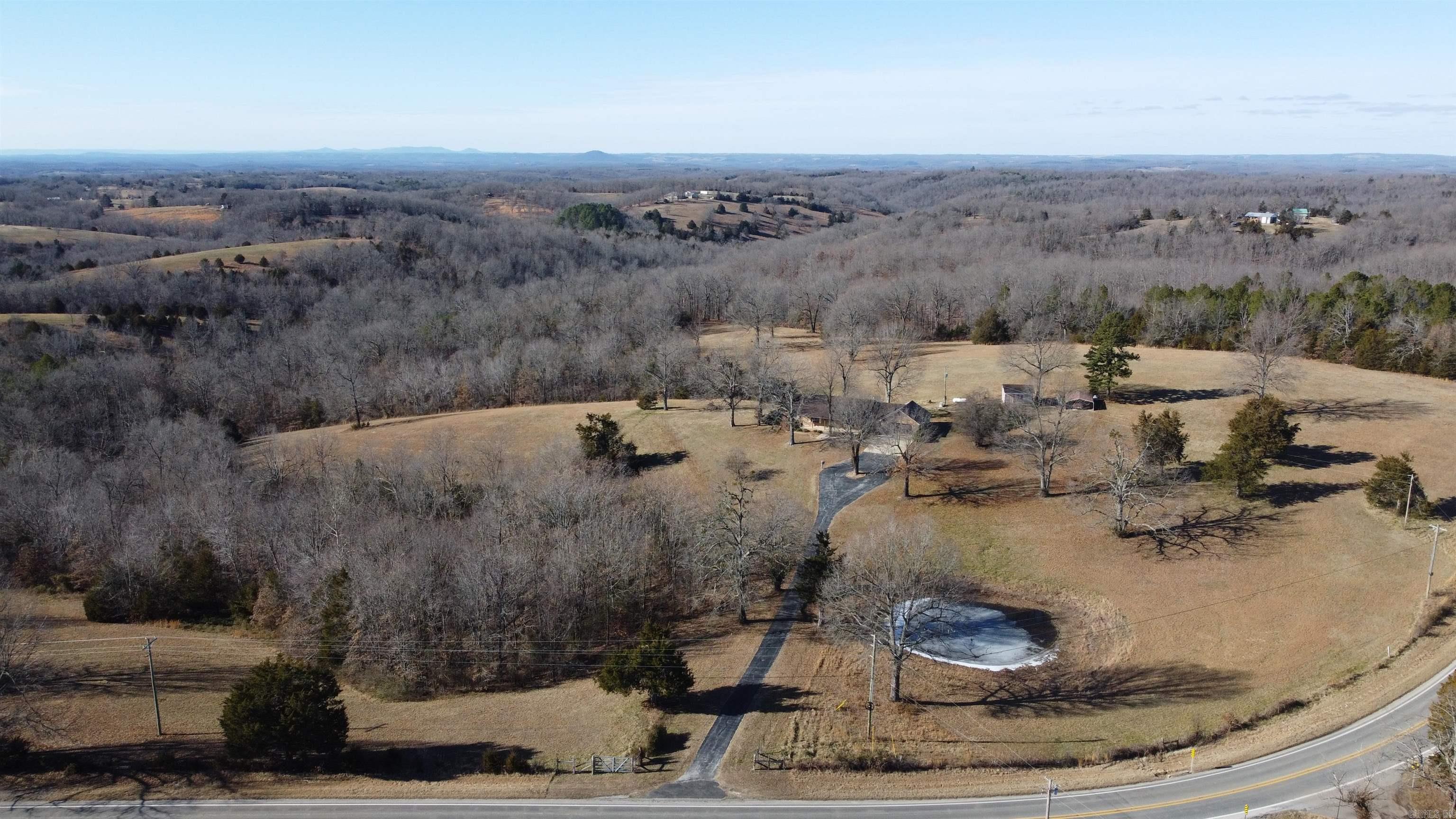 Nestled in the serene beauty of the Ozarks, this beautiful home sits on 65.72 +/- of recreational, timberland, hunting land, pasture land offering a peaceful retreat. A spacious 2-bedroom, 2-bathroom layout, with a oak kitchen with granite countertops. Master suite includes an en-suite bathroom with a walk-in shower. Approximately 560 sq. ft. of finished basement with a full kitchen, full bath, and large living area perfect for guests. A whole-house generator, a storage building, for added convenience. Fenced pasture and 2 ponds makes this property ideal for a small hobby farm. With high-speed fiber internet available, stay connected whether for work, streaming, or staying in touch with loved ones. This modern amenity ensures you donāt have to sacrifice connectivity for your peaceful Ozarks retreat! For the avid hunt the area has an abundance of wildlife consisting of whitetail deer, turkey, bear, and numerous small game animals. 10 minutes to Marshall for all area amenities and 20 minutes from the Buffalo National River for fishing, kayaking, hiking, and numerous outdoor activities. 1 1/2 hour drive to Branson where you can enjoy entertainment and shopping. DON'T MISS OUT!!!!