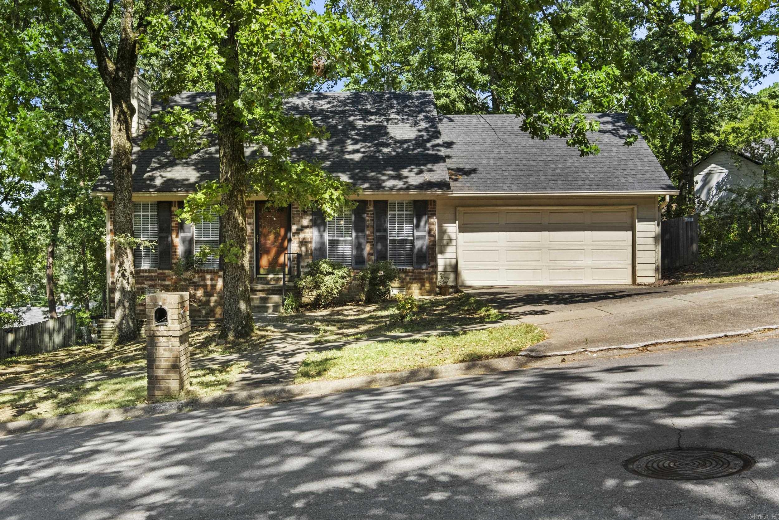Come see this great 3 bedroom, 2 bath home conveniently located close to shopping, restaurants and interstate access. And walking distance to the neighborhood pool will make summers more fun for your family! The large living room flows into the dining space and features wood laminate flooring and a brick surround fireplace complete with gas logs. The kitchen features granite look formica counters, solid wood cabinetry, an electric cooktop, Bosch dishwasher and pantry. The kitchen, open on one end with a breakfast bar that looks into living room, has an open concept feel. All bedrooms are spacious with generous closets. The guest rooms share a good sized hall bath with tub/shower combo. The primary bedroom features a walk in closet and ensuite bath. Laminate flooring and tile throughout! No carpet. 2 car garage with lots of storage. HVAC new in 2024. House is being sold as-is. Agents see remarks.