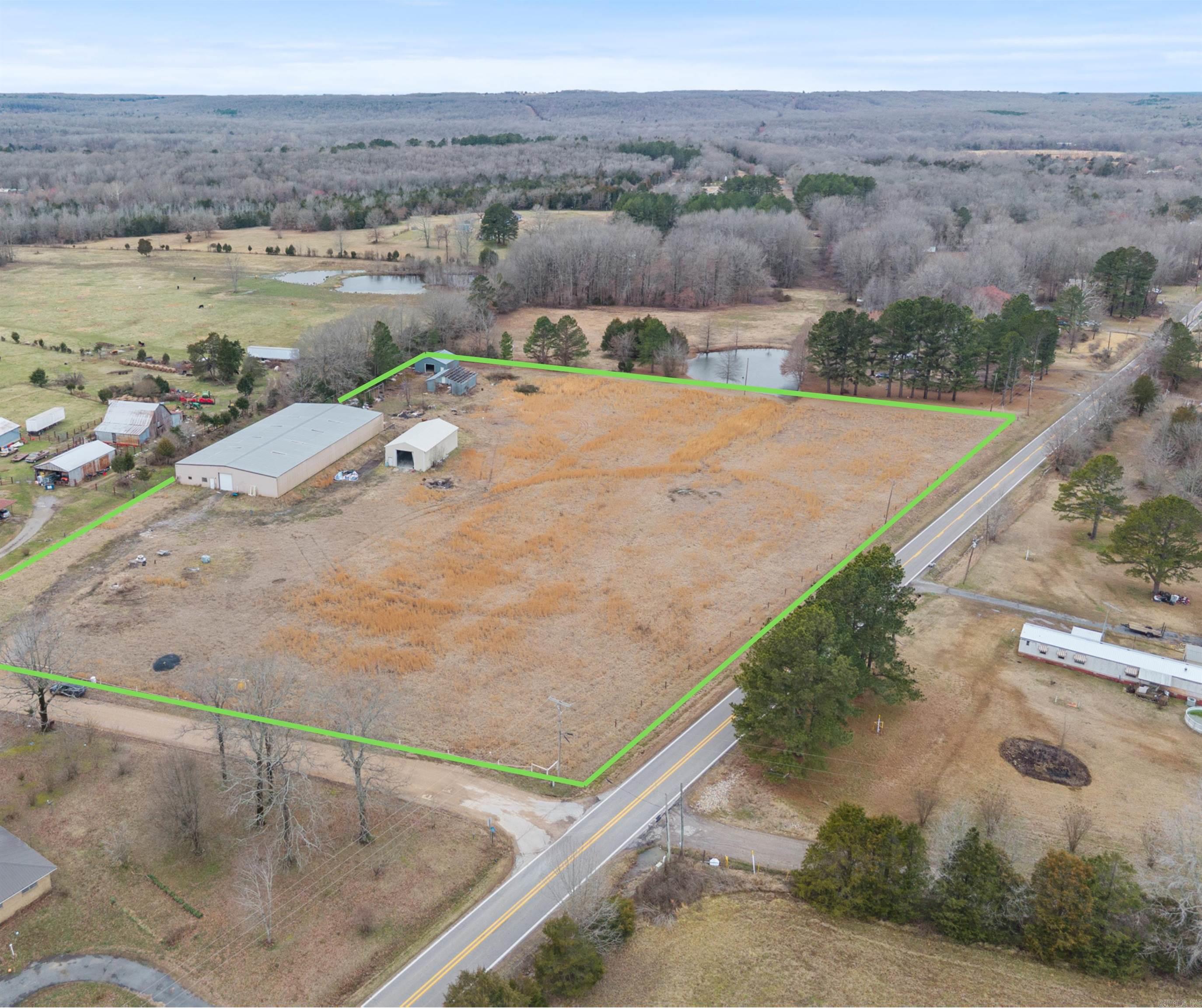 Rare opportunity for a new or established business or homestead. This property consists of 4 metal buildings on 8 acres. The main building is 75' x 150' and has 2 14' rolling doors. There is office/living and a bathroom. The second building also has 2 14' rolling doors. Property is being sold as is.