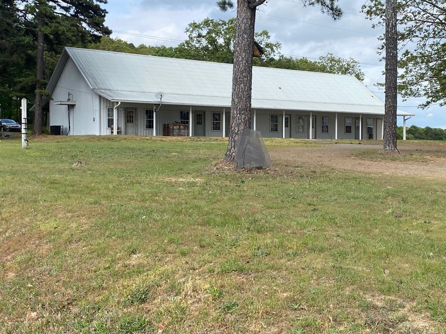 This building is approx. 3000 sq. ft with 5 units currently rented and another 3 spaces currently being used by the owner. This is designed to be 12 one bedroom units with shared bathrooms. The property does have room and electrical for additional RV hookups desired. The Warehouse next to it is also listed see MLS 498887. This is highway frontage property and has endless potential and possibilities! Don't miss out; call today!