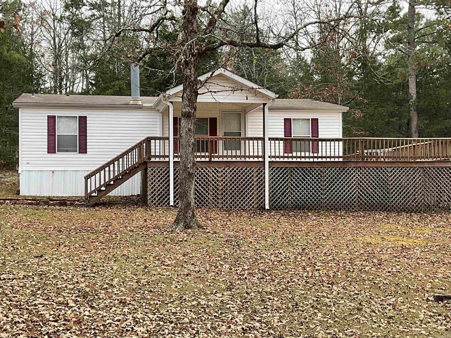 PRIVATE AND MINUTES TO TOWN.  You can't find a home on the market that is any cleaner and ready for you than this one.  A perfect home in a perfect area.  Split BR floorplan with guest bedrooms being bigger than average, fireplace in the den, large kitchen, separate laundry room and a wonderful master bedroom (nice walk-in closet) with large master bathroom that features a walk-in shower, Jetted tub & linen closet. You will enjoy the large deck wrapped around 3 sides of the home (36x52) and the 24x24 carport.  Peaceful (no thru-traffic), serene and wooded all around you.  Refrig. remains, Washer/Dryer nego.