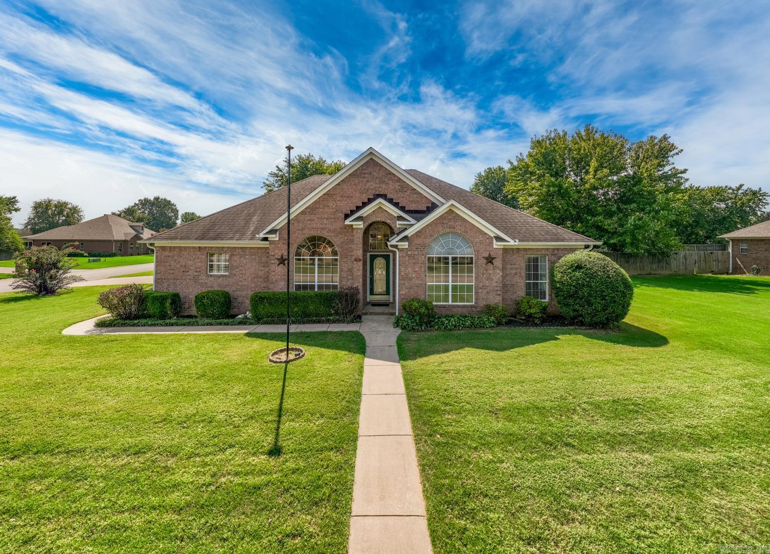 Welcome to this charming one-level home situated on a spacious half-acre corner lot with a side-load garage. Freshly painted and move-in ready, this property offers three bedrooms and two full baths. The large kitchen features an eat-in area and a formal dining room as well. The large great room opens onto a patio and deck overlooking the expansive backyard—perfect for entertaining or relaxing outdoors. Two versatile outbuildings, both equipped with electricity, provides options for a workshop, storage, or hobby space. A rare find with space, function, and convenience all in one! agents see showing remarks