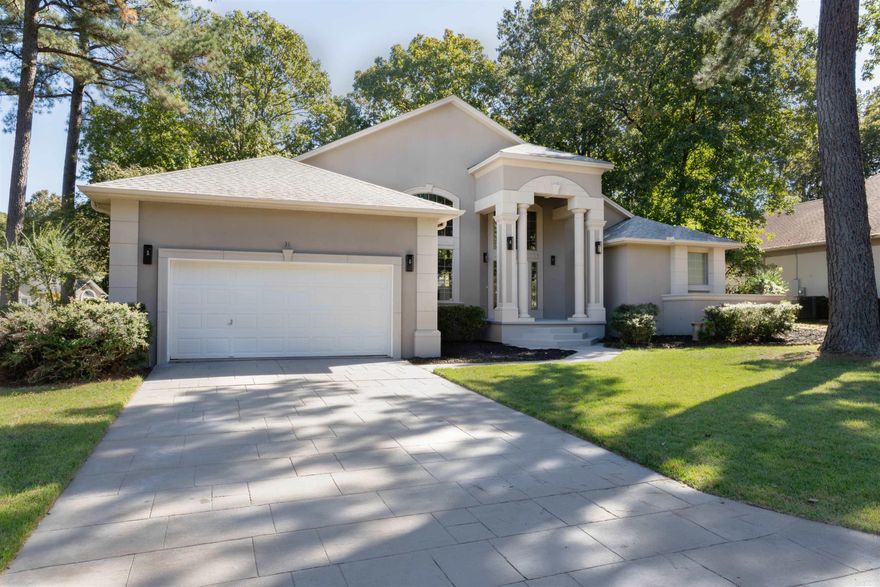 High-End Custom Remodeled Home in West Little Rock’s Chenal Valley!  Located on a beautiful corner lot, this single-story home recently underwent a comprehensive custom remodel, complete with trend-forward finishes throughout. Step inside to brand new engineered wood flooring, custom white oak cabinetry, and quartzite countertops.  Every detail has been curated with intention— from the fresh interior and exterior paint to new interior doors, baseboards, and crown molding. The bathrooms feature luxurious, curbless walk-in showers with high-end designer tile and fixtures.  This exceptional home combines the beauty and sophistication of a modern new build with the mature natural beauty and tranquility found only in one of Chenal Valley’s most established and sought-after neighborhoods.