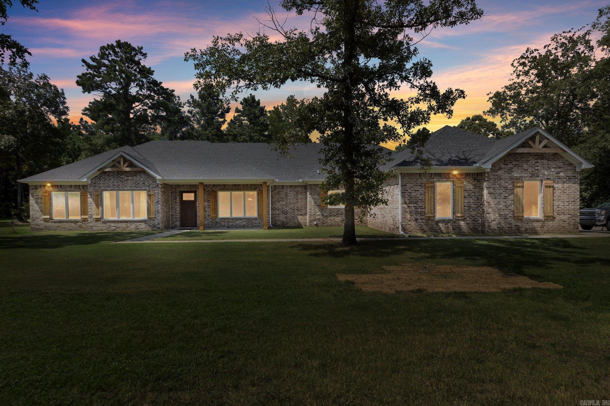SAY HELLO TO 201 BINGHAM WOOD RD! To begin, this amazing home is situated on 41.64 beautiful acres of land behind a gated entrance and nestled in a beautiful country setting, between Hensley & LR, with a stunning 3064 sq ft Ranch style home, 30x50 shop, with 2 large bay doors. Walk inside the foyer of this beautiful home and you are met with luxury. Open floor plan with a chef's kitchen of top of line appliances, an enormous island for planning and preparing for meals or parties, walk in pantry with tons of storage, safe room!! Large living room with a stone fireplace and beautiful light fixtures throughout the home. Right off the kitchen is a large office. Step into the master and it is dreamy, with a walk in closet, laundry room access, and master bath boasting his & her vanity spaces, tiled shower and soaking tub. The remaining bedrooms are at opposite end of the home with their own bathroom and privacy. Walk out the glass doors from the living area to the beautiful outdoor living space with stone fire place for amazing cool nights and plenty of room for relaxing and in addition a wooden deck with an amazing jacuzzi. So much more on the list, Schedule your tour today!