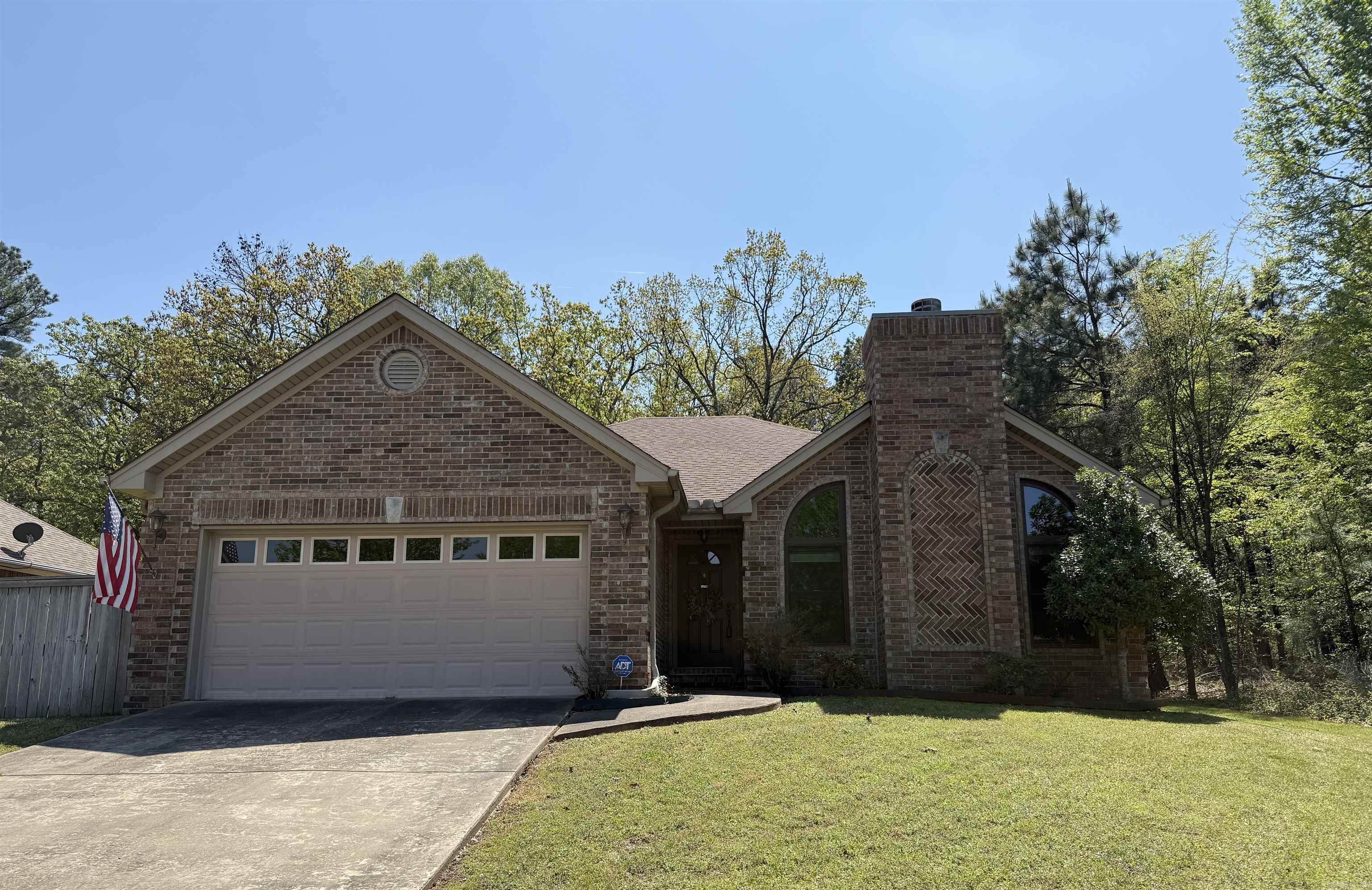 Lovely 3 bed 2 bath home in the Country Club of Arkansas. Vaulted ceilings and large windows show off the beautifully framed gas log fireplace and greet you as you walk into the spacious living room. Perfect for entertaining, the kitchen is open to the living room with a separate dining area. Stainless steel appliances, breakfast bar and pantry in the kitchen. Primary bedroom offers plenty of room for furniture and has a spacious feel with raised ceilings accented by beautiful crown molding. Walk in closet in bedroom & double vanities, jetted tub, and walk in shower in primary bathroom. 2 guest bedrooms and one bathroom can be found down separate hallway. Property sits on a beautiful lot that is surrounded by trees on two sides giving the feel of living in the country while the convivences of being in town. Fully fenced Backyard has covered patio space with an extended porch. Roof is 3 years old. 2 car garage and fiber internet being installed. Don't miss out on this incredible home!
