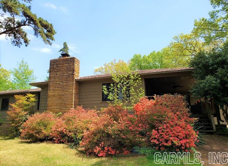 Introducing a stunning turnkey home with a new roof sitting on 2 lots with an abundance of features & storage options. The kitchen features a travertine backsplash adorned with stone countertops & modern stainless appliances, adding a touch of elegance to your culinary experience. The home is a true retreat, featuring plantation shutters, unique stained glass windows, can lighting, custom bookshelves, custom storage & desk, providing well lit spaces for work or study while ensuring a clutter-free yet productive environment. This home features Double master suites with private bathrooms, walk-in closet, pantry, and fireplace for those snuggle up nights. The outdoor spaces are equally impressive, with covered entertainment areas in both the front and back of the home. Whether you're hosting gatherings or enjoying a quiet evening, these spaces provide the perfect backdrop. For those in need of a dedicated workspace, a mini office, covered boat storage, and 25x25 workshop are also here. With its versatile spaces & storage options, this home offers the perfect blend of practicality & comfort and all just a 1 minute walk to Miller's point Bluffs. Contact us today to schedule a viewing!!