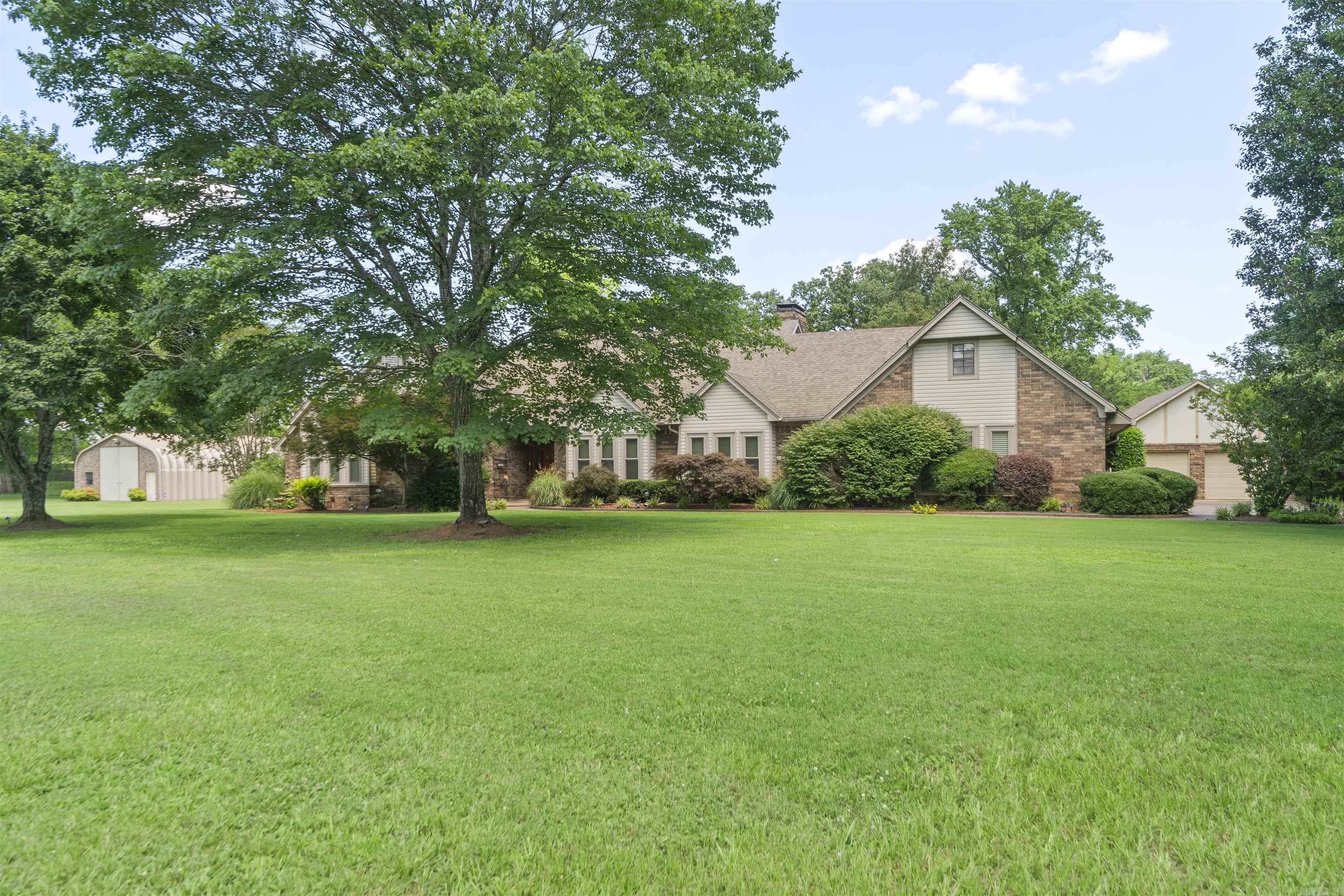 Just what you've been waiting for! A lovely home on acreage in Turtle Creek just outside of Haskell. This home sits on 2.42 acres of level manicured yard which is completely fenced and includes a beautiful security gate. Do you have RV's, toys, trucks, a boat or a hobby? Take your pick of two shops! 24x36 and 24x40 - both with electric. Relax by the beautiful heated in-ground pool surrounded by lush landscaping and several areas to chill out or entertain. The interior is stately and has a well thought out floorplan including a gameroom/sunroom and an upstairs bonus room with could also serve as a 4th bedroom complete with it's own full bath. Don't distress if the power goes out! You'll have a generator to the rescue that will service the entire home and pool! Make your appointment and don't miss out. This one will not last!