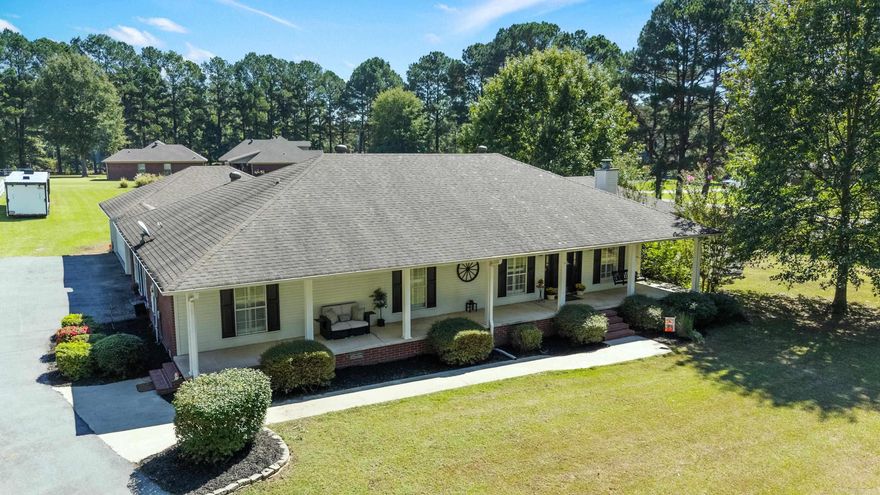 Beautifully updated home on a level 3.16 acre lot with a barn and fencing for horses. The wide front porch welcomes you inside to fresh paint colors, vaulted ceilings, hardwood floors throughout, and detailed millwork in the living, kitchen, and dining rooms. The spacious kitchen features granite countertops, stainless steel appliances, and abundant work space. A formal living room with fireplace adds warmth and charm, and a large bonus room with two closets and a full bath offers flexible living options. The oversized dining area opens with French doors to a pergola covered deck that is perfect for entertaining. The private primary suite also has French doors to the deck, two closets, and a bathroom with a jetted soaking tub. Outside you will find a low maintenance vinyl fenced yard, oversized two car garage with storage and a workbench, and a barn with stalls, water, electricity, and storage. The home has been pre inspected so you can buy with confidence. **Agents see remarks