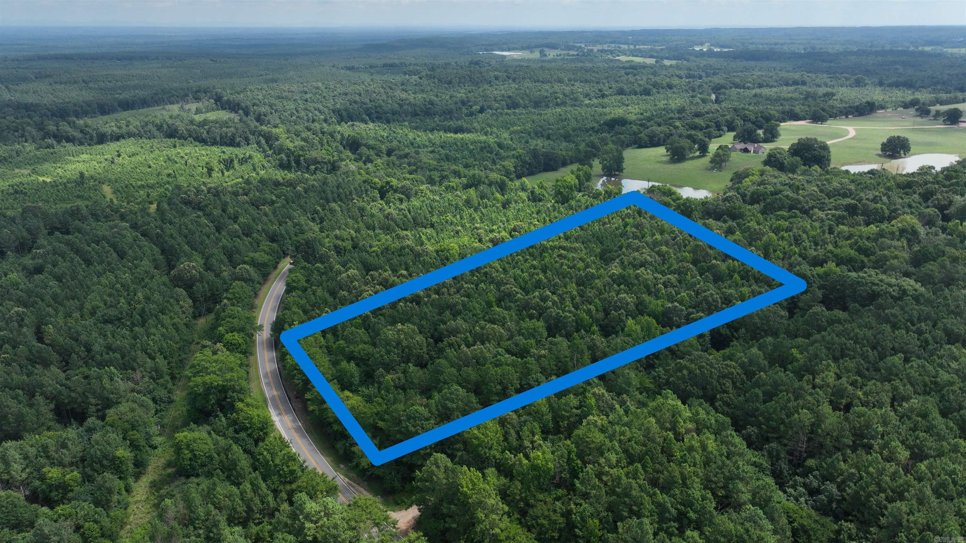 5 Acres of Vacant Land available in Howard County Arkansas, for a great price! Located on Paved Highway 26, this land has access to Water and Electric. Whether you are looking to build your dream home, hunt, or invest, this property is for you! No HOA, No Restrictions. Only 18 minutes to Nashville Arkansas.