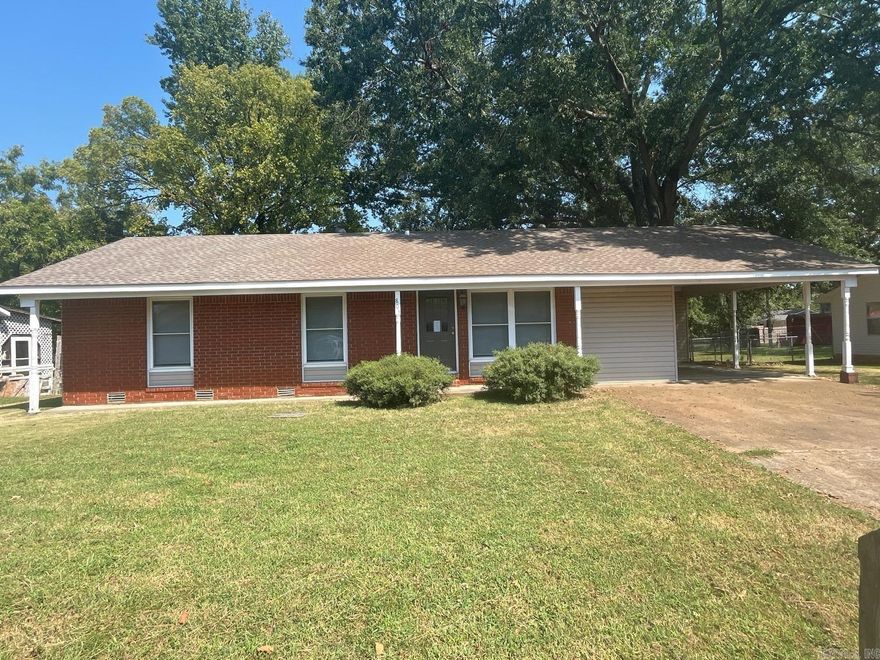 Completely remodeled 3 bedroom 1 1/2 bath home. The following are new: roof, flooring, dishwasher, and range. Bathroom shower updated. Laundry room, deck in back with built in seating, large fenced yard and 1 car carport.