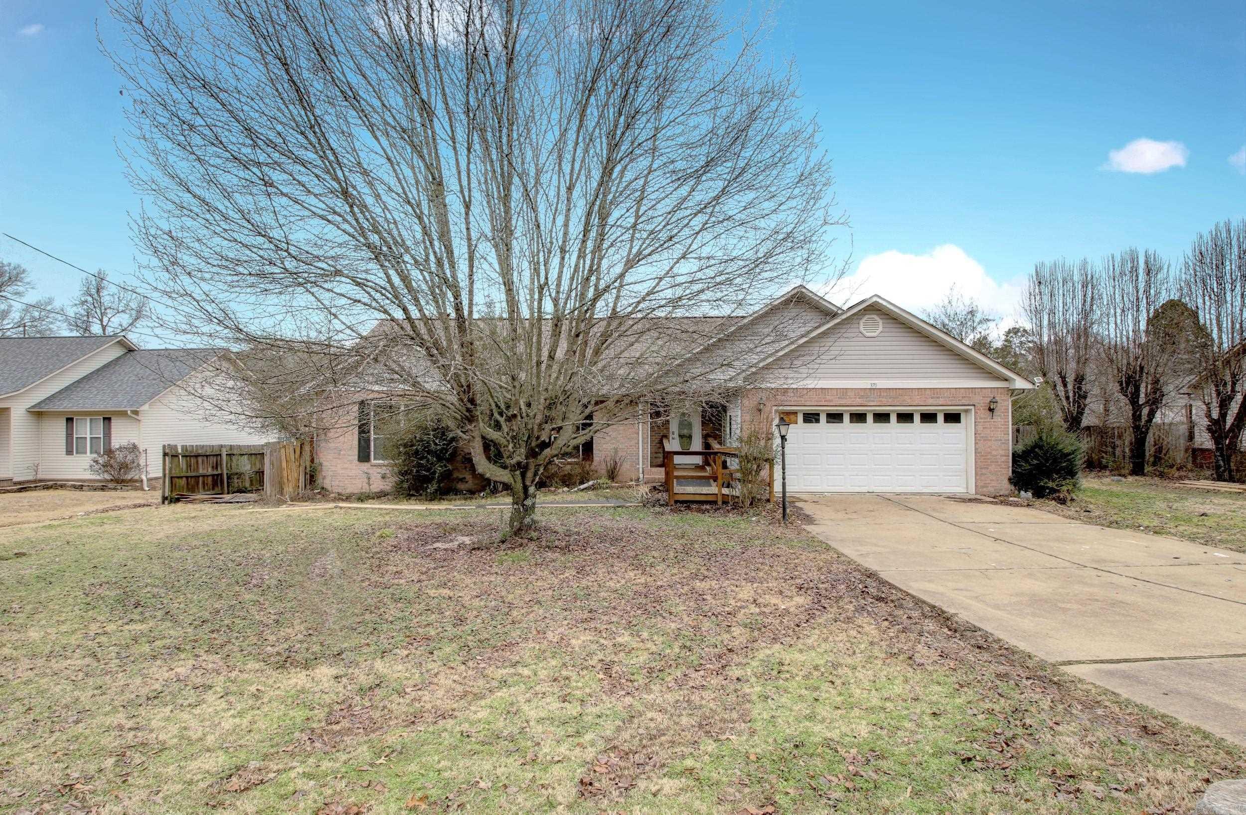 Three bedroom, Two bathroom home located a 4 minute walk to Lake Hamilton with convenient boat launch access, and only moments to dining and shopping, and the interstate. Make this home yours with some TLC. Huge open living space with vaulted ceilings and nice foyer leading to a living/dining combo area. The extra large kitchen allows for additional dining space. This home is being sold ASIS WHERE IS. Seller will share the inspection report!! Minor plumbing repairs have already been completed and yard clean up will be competed ASAP. Schedule your appointment today this one won't last long!! AGENTS SEE REMARKS