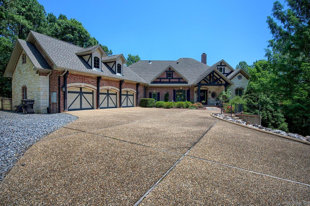 Truly a home of distinction with an abundance of custom detail and quality workmanship. English Tudor style with dormers and supersized 3 car garage. Magnificent covered patio with screened porch on one end. Hand scrapped wood floors, spacious kitchen with warming drawer, custom cabinets, island, walk-in pantry. Laundry adjacent to MBR; office/study adjacent to MBR; Jack & Jill Bath for BR 2,3; Large Safe Room/storage w/shelving in crawl space; Fenced "doggie" yard with gravel & turf. Listing includes 2 additional lots for added privacy. Optional 4th bedroom. 3478 sq. ft built in 2009 by Ellison Construction, quality throughout!