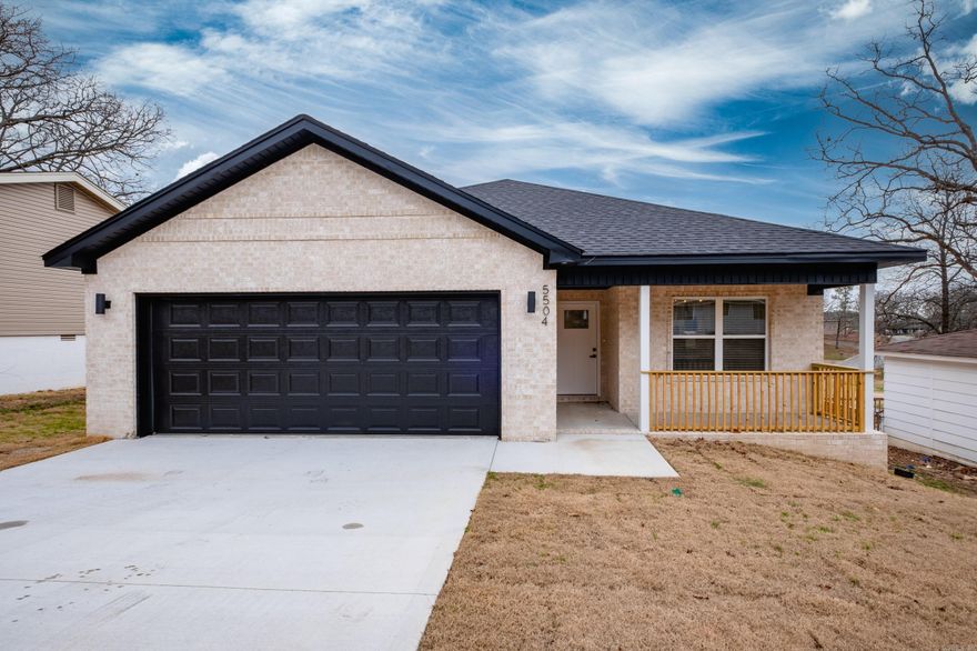 Brand-new custom construction with exceptional buyer incentives in the heart of North Little Rock. This home qualifies for special grant programs that may be applied toward down payment and closing costs, offering a rare opportunity to own a high-end new build with meaningful financial assistance. Located just minutes from Burns Park, historic Park Hill, and Little Rock Air Force Base. Thoughtfully designed as a single-level, all-brick home, the open floor plan features 9-foot ceilings, luxury vinyl plank flooring throughout, modern lighting, crown molding and shaker-style doors. The kitchen has quartz countertops, a tiled backsplash, a breakfast bar, and a pantry. A modern electric fireplace with a stained wood beam mantle adds warmth and character to the living space.The primary suite offers natural light, a custom walk-in closet with built-in shelving, and a spa-inspired bathroom with quartz countertops, a double vanity, a soaker tub with wall-mounted fixtures, and a fully tiled shower. Step directly from the primary suite or living room onto the covered back porch. Additional highlights include a separate laundry room, a two-car garage, ceiling fans, and blinds throughout.