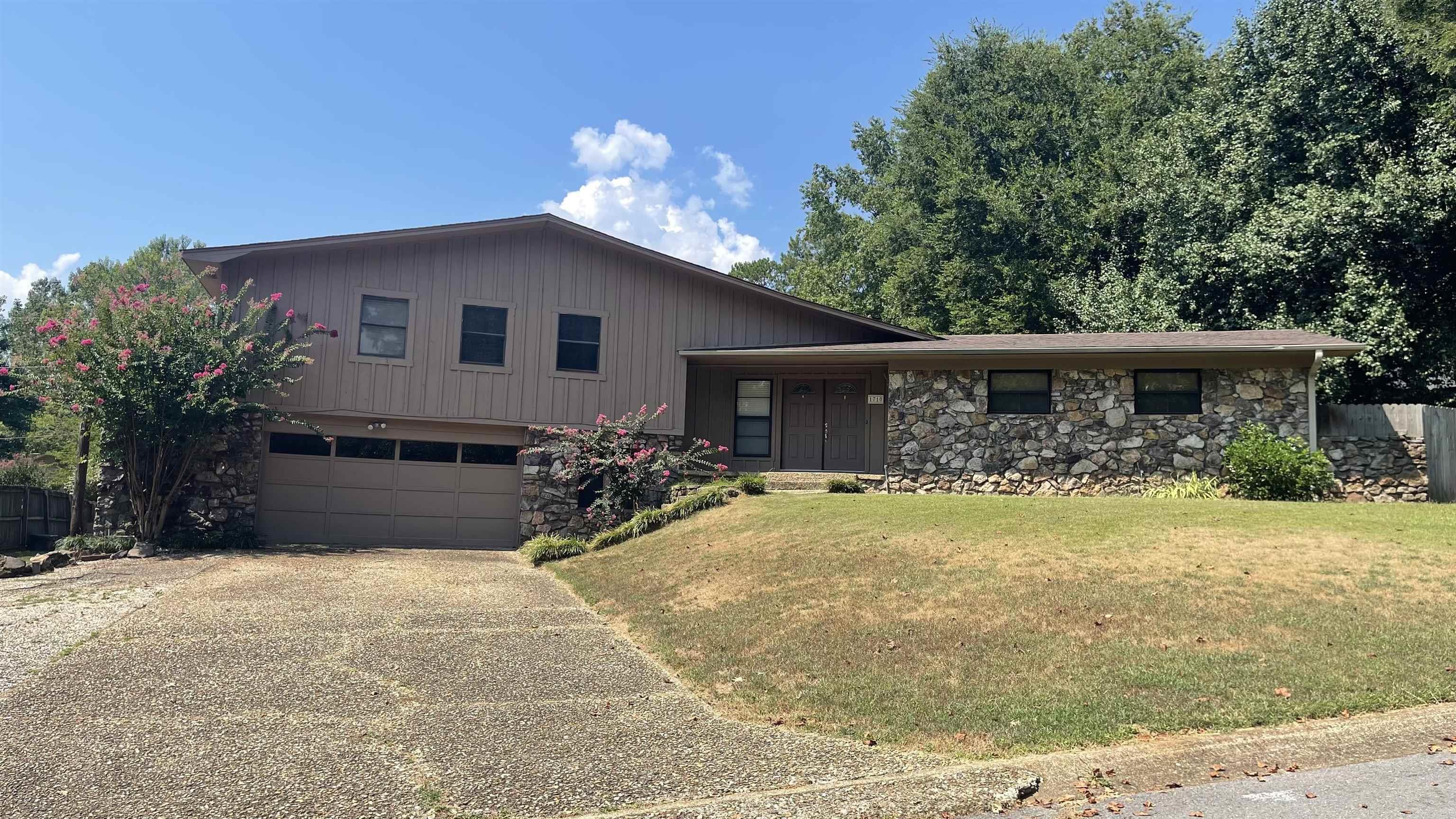 Need lots of room? Look no further. This rock and frame 3 bedroom 2-1/2 bath home has so much going for it. It has a "real" fireplace, dining room and eat-in kitchen on the main level. There is lots of storage in the kitchen area. The laundry is off of the kitchen plus there is a large cedar lined room that would be great for out of season clothes or Christmas decorations. Seller has removed the popcorn ceiling on the main level. Upstairs are 3 bedrooms plus 2 baths. The main bedroom has a huge walk-in closet and a walk-in shower. A bonus room is on the lower level. It has a built-in cabinet along the exterior wall and would be great for an extra bedroom, office or another living area. It also has a half bath. The outside air unit is approximately 4 years old, the roof is approximately 12 years old, and it has a new water heater. Square footage taken from public records. Please feel free to measure.