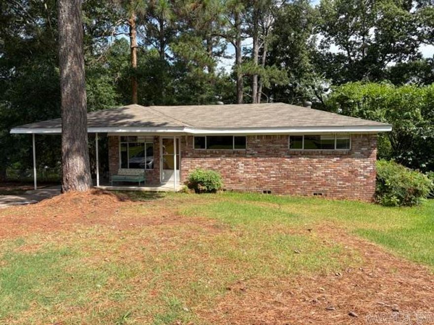 A great starter home, one level, fenced yard. Needs some TLC.  Nice hardwoods. Siding in carport needs replacing. AS IS Seller is in the process of removing Dead tree. Laundry Room is located off of carport.