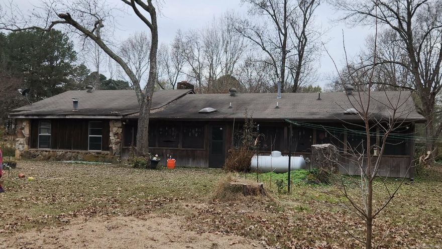 Fixer Upper home with lots of potential from pens & sheds for animals, shop, & pasture acreage.