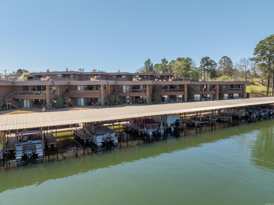 Welcome to this stunning lakefront condo with breathtaking views. The spacious open concept living area offers an abundance of natural lighting with a beautiful rock fireplace. Step out onto your private covered patio and be only steps away from the lake and your own private boat slip. The community offers a swimming pool, picnic area and swim platform. The grounds are beautifully maintained and offers a gated entrance. Conveniently located to dining, shopping and entertainment. Don't miss this opportunity to own your own slice of paradise. Schedule your private viewing today. Three month minimum on rentals. Pre approval letter required with all offers. ***selling unfurnished*** ***no sellers property disclosure***