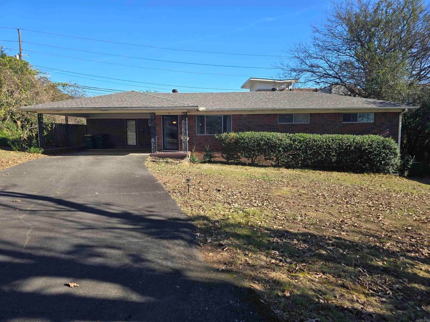 Newly listed well-loved brick beauty is full of charm offering abundant space in every room and closet in a cozy, inviting home. This 3-bedroom, 1.5-bath ranch-style home features approximately 1,500 sq ft and is tucked away on a quiet cul-de-sac. Enjoy the convenience of a prime location minutes from Midtown shopping, CHI St. Vincent, UAMS, Interstate access, and the newly name Hall High Charter School. Meticulously maintained, the home boasts a NEW roof, hot water heater, and newer HVAC system. The open kitchen, dining, and great room create an ideal space for everyday living and entertaining, enhanced by plentiful natural sunlight. A double carport provides ample guest parking. Original hardwood floors add character, while the generously sized laundry/utility room & the extra space off the dining area offers an office or family room. All closets are spacious and the remodeled kitchen and bathrooms means little remains to be done to make this home your own private retreat. Step outside to a private, fenced backyard featuring a patio, ready for an oasis makeover. Ring alarm system conveys; refrigerator is negotiable. Experience a country feel in the city! See agent remarks!