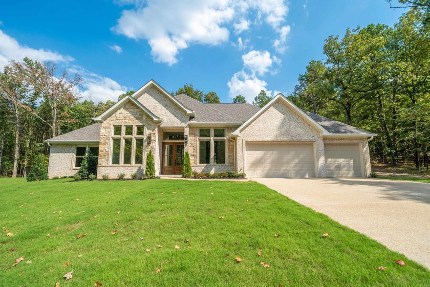 New Construction in Highly Desired 7 South location. Stunning Home with the features you are looking for. Wood beamed ceilings add charm to this open floorplan that welcomes your family and guests. Enjoy cozy holidays around the fireplace. Large granite island in the chef’s kitchen, double ovens and custom cabinets. The butlers pantry makes entertaining a breeze. The primary bedroom features walk in closet and ensuite with luxurious finishes. Stairs to attic for storage. Deeded lake access. Lake Views , across the street from Lake Hamilton. Estimated completion Fall of 2025.