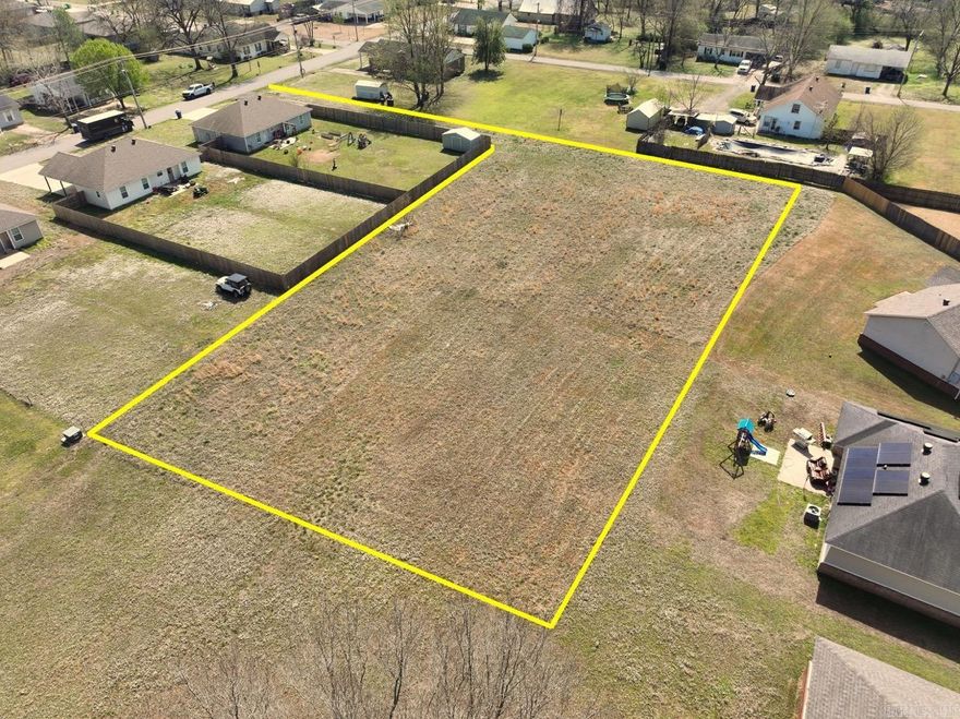 This 0.85-acre lot sits within city limits yet is tucked off the road for added privacy. With a wide, open build area and a long private drive, the layout offers flexibility for your ideal home site while still maintaining separation from the street. Surrounded by established homes and fencing, it provides a sense of space and privacy that’s hard to find in town.  The property is mostly level and cleared, making it ready for development with minimal prep work. Its unique shape allows for a private homesite toward the back while still offering convenient access up front. Whether you’re looking to build now or invest for the future, this lot delivers a rare combination of size, usability, and location.  Enjoy the convenience of being close to everything Beebe has to offer while still having enough room to create your own quiet retreat.