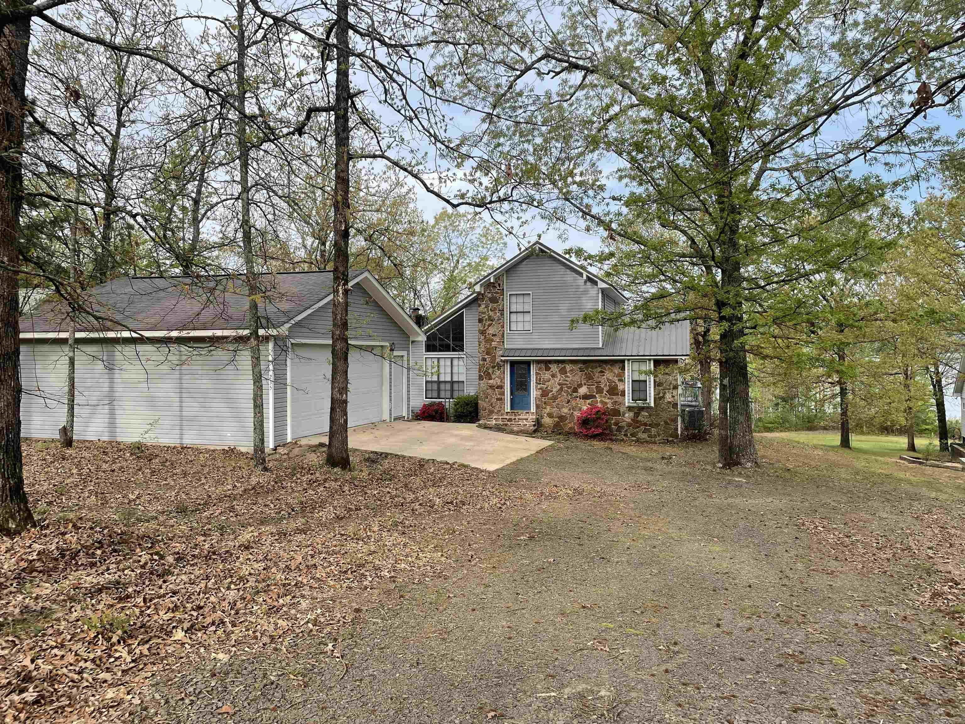 LAKEFRONT!! This beautiful lakefront home located at the North end of the Narrow boast a great view of the lake and Poker Island. The open floor plan allows for big gatherings. This house has a wood burning fireplace on the main level. The Master bedroom is located on the main level. The walkout basement has a game room and one bedroom and one bath. The upstairs area has a walk out deck and one bathroom. The property also has a detached two car garage 20 x 24.