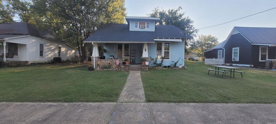 Come see this Two Story Home in the Heart of Downtown Mena! Original hardwood floors, high ceilings, open and inviting living/great room. 2 bedrooms on the first floor and 2 on the second floor. The home is near Janssen Park. Detached unfinished garage. Wonderful sitting porch on the front and enclosed screened back porch.