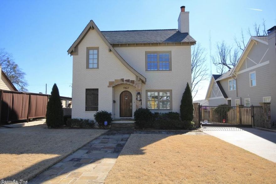 Stunning home with beautiful features.  Updated open floor plan with Living room, Kitchen and Dining on main level.  Cooks kitchen with chefs range, built-in refrigerator stays, slab counters and island seating.  Upstairs has 3 bedrooms plus playroom (this could be 4th).  Luxurious master suite with unbelievable finishes.  Walk-in closets.  Covered porch, two car garage, and yard.  Come see!  This will not last long.