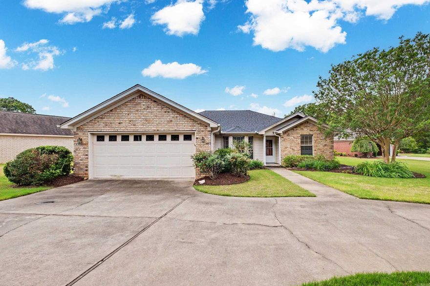 Lovely brick home close to Lake #1!  Large living area with gas fireplace and tray ceiling, primary bedroom is separate and features a tray ceiling, oversized walk in closet with built in shelving, double vanity, jetted tub and walk in shower.  Kitchen has beautiful wood cabinetry, tiled floors and leads to laundry room with large sink and pantry area.  Large fenced back yard with storage building and four garden boxes.  Corner lot with sprinkler system.  Circular driveway allows for extra parking.  Garage has closet for extra storage.  This home is a GEM!