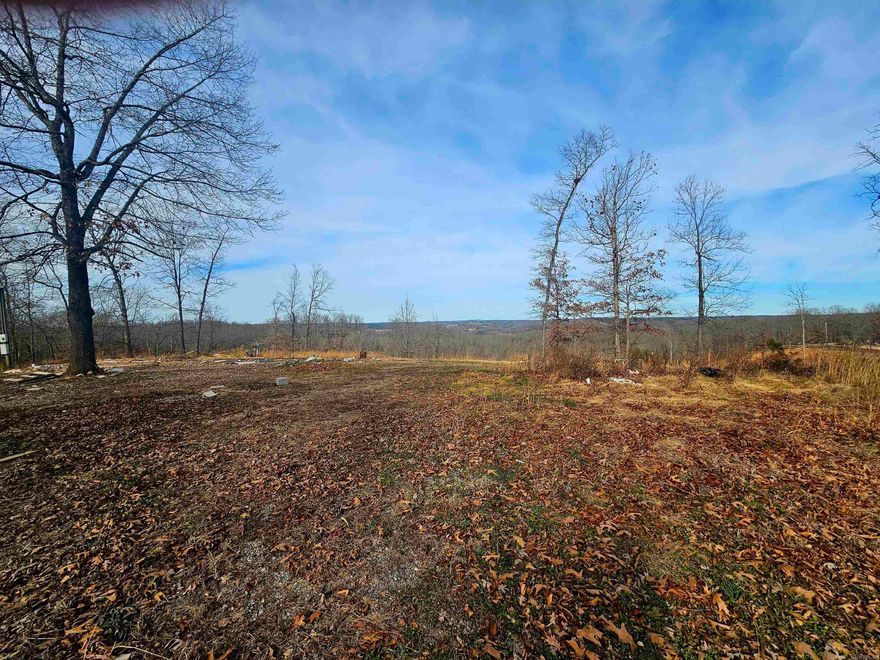 3.31± ACRES in Searcy County, Arkansas, located approximately 3 MILES FROM GILBERT & MINS. FROM THE BUFFALO NATIONAL RIVER. This attractive parcel offers BEAUTIFUL OZARK VIEWS in a quiet rural setting with the convenience of a few nearby neighbors.  A mobile home was previously located on the property, making it well suited for a new mobile home, cabin, or future home construction. The land is mostly level and usable, with slight elevation changes that enhance the scenic views. UTILITIES were previously in place when mobile was there. Have your agent to verify these.   Ideal for a starter homesite, vacation property, or weekend retreat, with convenient access to floating, fishing, hiking, and the outdoor lifestyle the Buffalo River area is known for. Gilbert offers small-town charm and a relaxed river community atmosphere.  Some remaining debris from the prior home removal is present but would not be a hard clean-up.  This is an awesome opportunity for land near the River, no matter how you look at it.    A great opportunity to own a well-located parcel with views and development potential.  Life really is better in the Ozark Mountains! :-)
