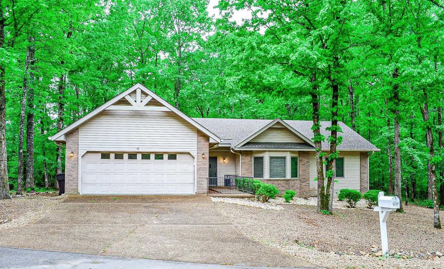 Over-sized lot at the end of the cul-de-sac.....this 3 bedroom 2 bath one level home is easy maintenance. Many recent updates include roof, flooring, interior paint(including the garage floor) and fresh stone-scape landscaping. One of Cooper Homes modified "Jose" floor plans. Great open floor plan with vaulted ceiling great room, wood burning fireplace and living/dining combination. You will love the roomy bedrooms , separate laundry room and expansive deck. Surrounded by privacy and your own seasonal creek yet conveniently located near the center of the Village. The Hot Springs Village Property Owner Association has a new member buy-in fee of $1500.00 due and collected at closing.