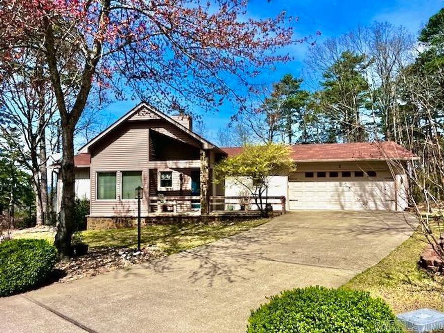 Are you looking for a two bedroom home and want something special? Just a few of these unique homes were built in the Village. Welcome to 2 Balenciaga Way—an adorable home that blends charm, comfort, and convenience in one beautifully maintained package. This light-filled residence features a vaulted kitchen with a functional island, making it ideal for both everyday living and entertaining. The cozy living area is also vaulted and anchored by a central fireplace with gas logs, creating the perfect spot to relax and unwind. Both bedrooms offer private en-suite baths, providing comfort and privacy for residents and guests alike. Step outside to enjoy a back deck overlooking a peaceful, garden like  backyard, perfect for morning coffee, evening grilling, or simply soaking in the natural surroundings. The easy-flow layout includes a conveniently located laundry room near the front entry with direct access to the garage. New updates include a newly fenced back yard, new carpet in the bedrooms and fresh paint throughout.  Charming, updated, and move-in ready—this delightful home is one you won’t want to miss!  Agents see remarks.