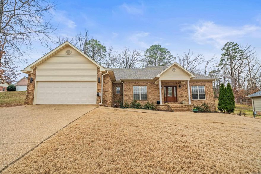 Discover this charming 3-bedroom, 2-bath home on a spacious 0.63-acre lot in Hot Springs, AR. Featuring a split floorplan, the home boasts a large living area with beautiful tray ceilings and abundant natural light. The all-electric kitchen offers tons of cabinet space, perfect for storage and organization. The primary suite includes a generous walk-in closet and a tray ceiling for added elegance. Step outside to enjoy the stunning backyard, complete with a pergola, firepit, and covered patio and newly installed French drains - perfect for both relaxing and peace of mind during rainy weather. New HVAC installed December 2024, water heater and roof less than 3 years old! Conveniently located near local amenities while tucked away for privacy, this home is a must-see.