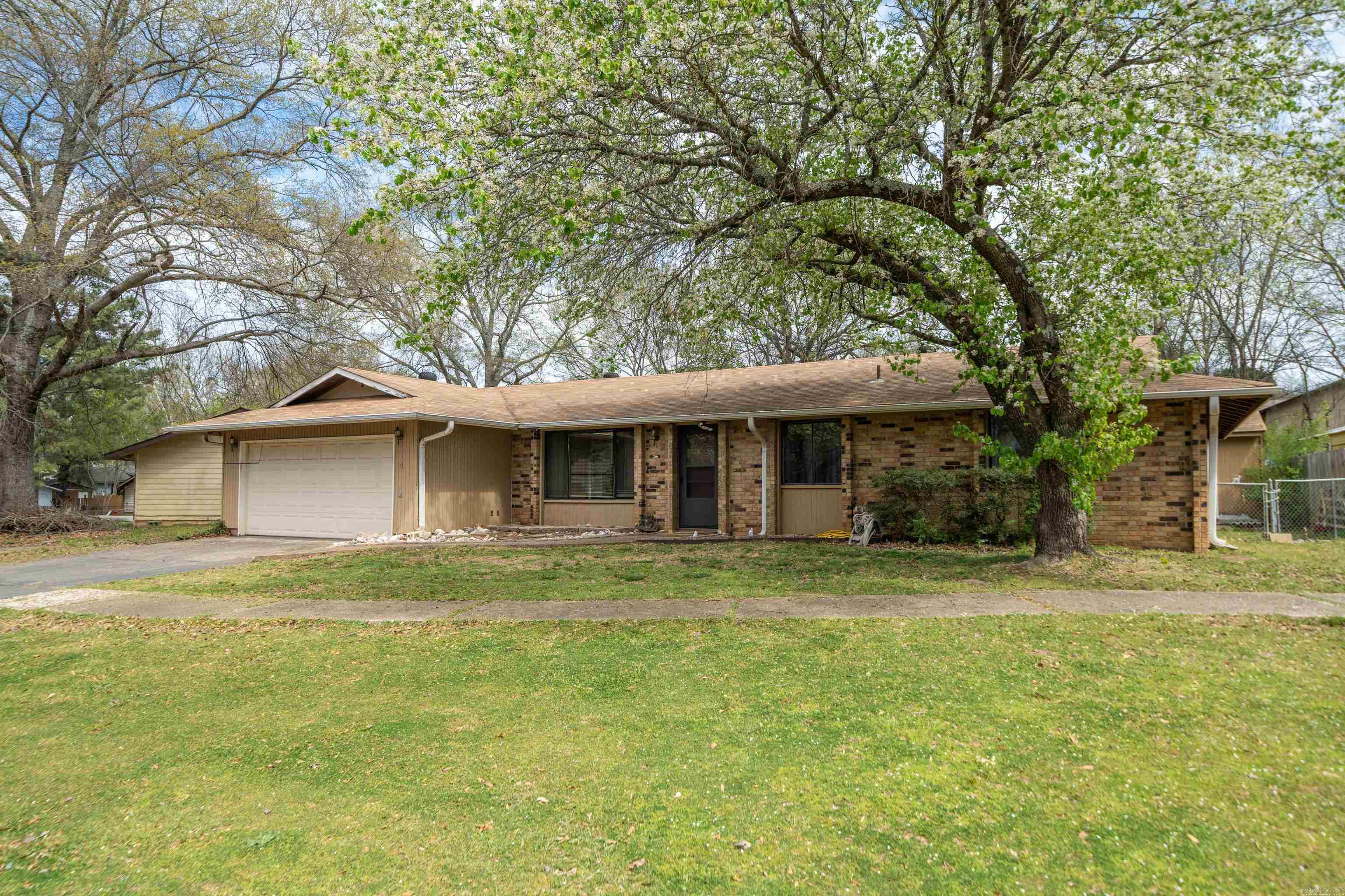 This charming home is nestled in a peaceful neighborhood and is in the Lake Hamilton School District. This home features two separate living areas, 3 bedrooms, 2 bathrooms, and is 1464 square feet. Relax in the hot tub or relax on the back deck. The large storage building in the backyard would make a great workshop. This home is conveniently located near National Park College, restaurants, and shopping.