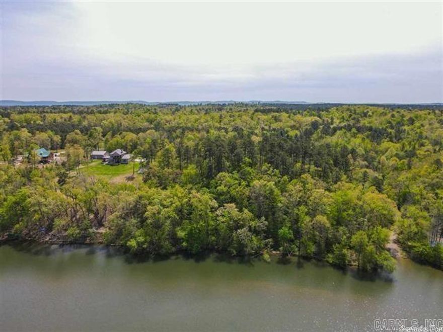 Beautiful wooded acreage with frontage on Lake Hamilton. Come build your dream home on over 4 acres.