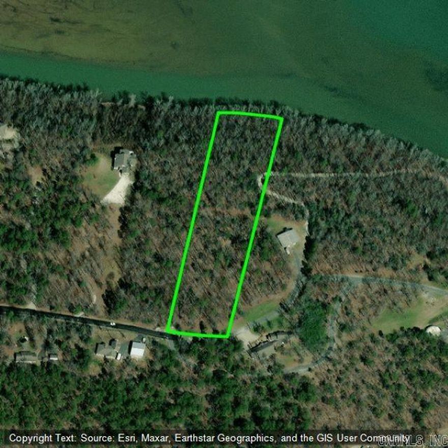 Beautiful wooded acreage with frontage on Lake Hamilton. Come build your dream home on over 4 acres.