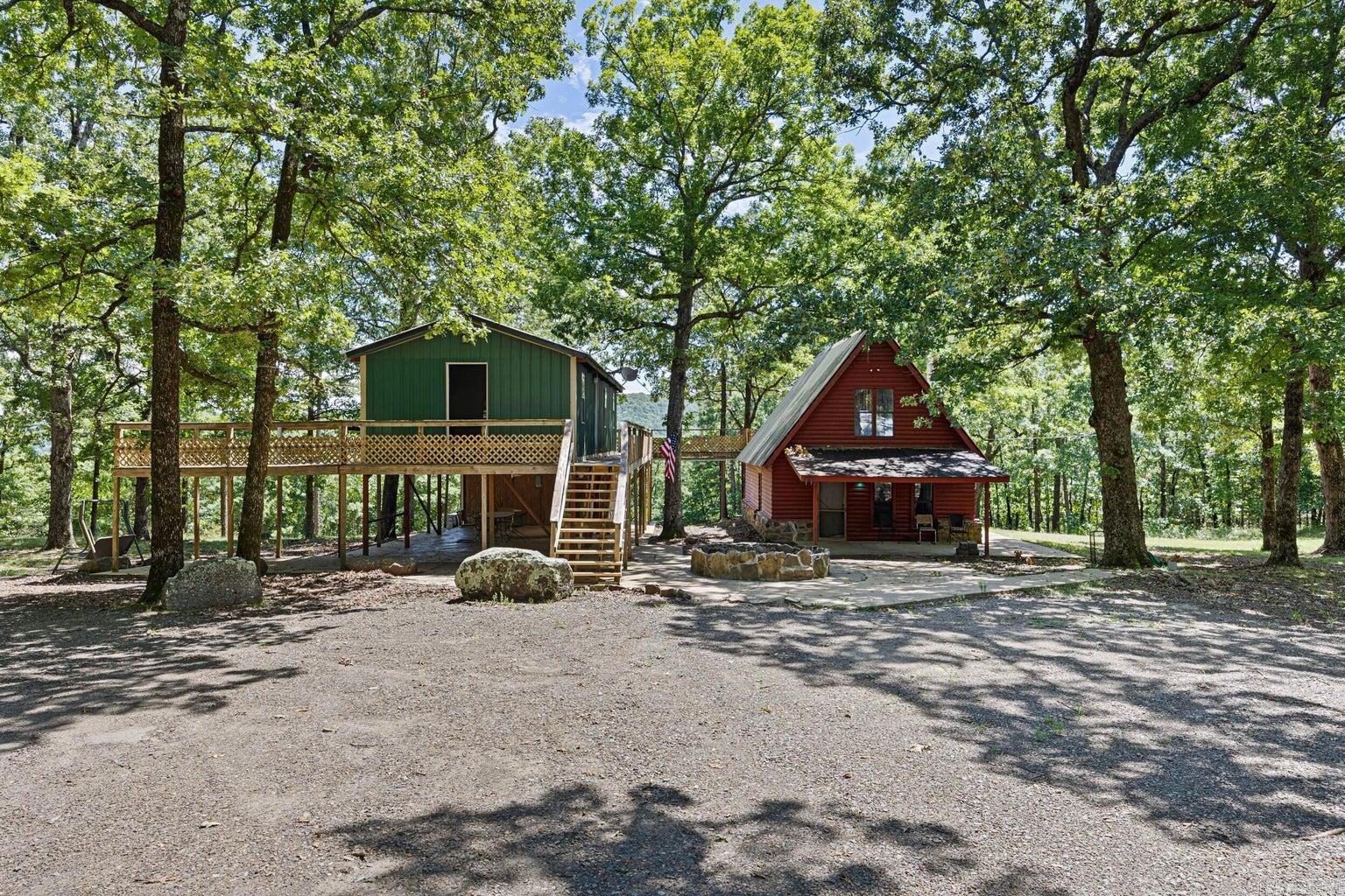 A Lucrative Retreat on 17+ Acres Adjacent to National Forest Discover the perfect investment opportunity with this versatile 17+ acre property next to over a million acres of National Forest. Featuring an A-frame cabin and a secondary guest cabin, it's ideal for vacation rentals, retreats, or events. A-Frame Cabin: The bright, open-concept living space offers high ceilings and large windows that flood the home with natural light. A cozy living room, spacious dining area, and modern kitchen lead to a loft with stunning forest views. Secondary Cabin: With two bedrooms, two bathrooms, and a welcoming living space, it’s perfect for hosting guests. Both cabins have city water and Wi-Fi, with direct access to trails for hiking, biking, and more. Don't miss this rare opportunity—schedule a viewing today!