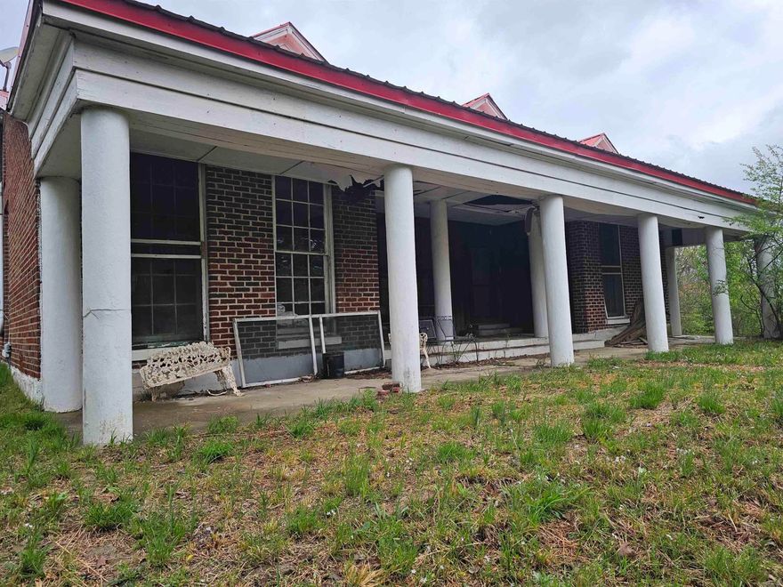 EXCELLENT PRIME COMMERCIAL LOCATION WITH A CREEK at one of the busiest intersections in Mena, Ar.  This 2.84 acres has a front entrance on Hwy 71 and back entrances on Pickering and Wagoner, garage, shop and city utilities.  Possibilities are endless.  The home on Wagoner has no value.  Will NOT subdivide. Agents must see remarks all before showing