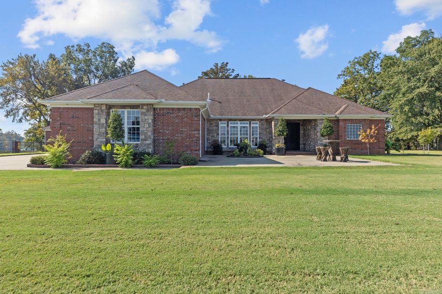 This exquisite home boasts a contemporary open-concept design, allowing for seamless transitions between living spaces while offering breathtaking panoramic views of the sparkling lake that can be seen from most of the rooms. Experience the joy of lake life & upscale living with an everyday lifestyle! Impeccable 1.11 acres a personal deck & boat ramp nestled behind a private gate. Perfect for hosting unforgettable gatherings or unwinding in a peaceful oasis. Whether you're entertaining guests or simply seeking solace, the combination of luxury features & the captivating lake backdrop make this home a true gem. This stately one-level floor plan combines sophistication and accessible living. Whether you have a large family or are an empty nester, this home is perfect with an enormous master suite, 2 living areas, double-sided fireplaces, sunroom, & expansive patio. The Gourmet Kitchen offers an abundance of storage, built-in refrigerator/freezer, breakfast bar, great counter space, dining area, wet bar w/ ice maker, surround sound, 2 separate offices, extensive crown molding, 11-foot ceilings, XL sunroom, formal dining room, foyer, & 4 plus car garage with a half bathroom & storage