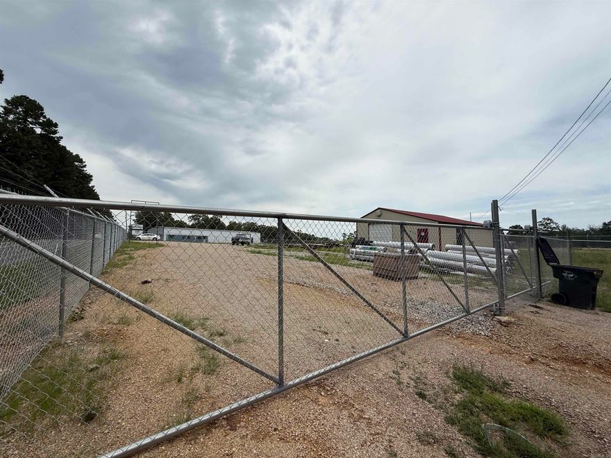 Prime Commercial Opportunity on 1.2 Acres   Unlock the potential of this fully fenced and gated 1.2-acre commercial property, ideally located with approximately 200 feet of highly visible frontage on Fox Pass Cutoff in Hot Springs. Whether you're launching a new business or expanding an existing one, this versatile property offers a rare combination of security, accessibility, and infrastructure.  At the heart of the property is a well-built 30' x 40' metal shop, perfect for automotive use, light manufacturing, or conversion into office or storage space. The level lot offers ample room for parking, storage, or future development — making it an excellent candidate for a self-storage facility, contractor yard, automotive repair center, or other commercial ventures.  Key Features:  1.2 acres of flat, usable land  Fully fenced and gated for security  200' of road frontage on Fox Pass Cutoff  30' x 40' metal shop with flexible interior use  Easy access to major roads and only minutes from Hot Springs city center