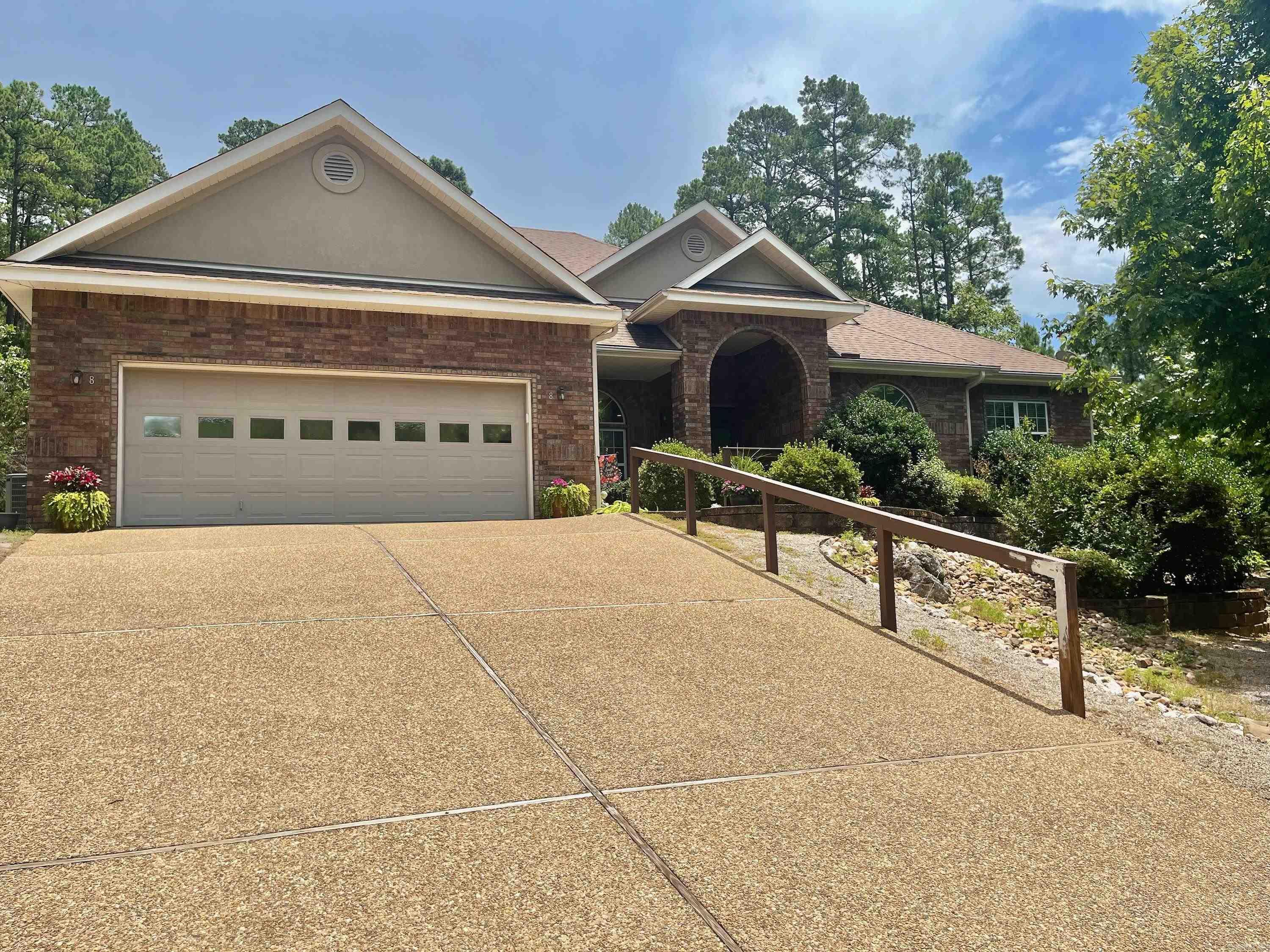 Wait until you see this beautiful retreat. You will feel like you are in the clouds. Close to everything and still in your quiet place. This home has it all, serenity and beauty. Large living area with fireplace and a view of the forest, bird lovers and nature lovers will be so happy. Great eat in kitchen with Quartz counter tops and Large separate dining area. Kitchen is open to a spacious Great Room with fireplace. Large Master bedroom with Hugh bath and walkin shower and closet. Plus Den/Office. Lots of storage, 2 bedrooms and guest bath on other side of the house. Large laundry area. Home is equipped with Central Vac. Luxury Vinyl flooring gas fireplace and a whole home generator. Partially covered back patio. New smoke alarms June of this year with 10 year guarantee. Irrigation system in place. Don't let the drive scare you, it goes right into the garage and into your sanctuary.