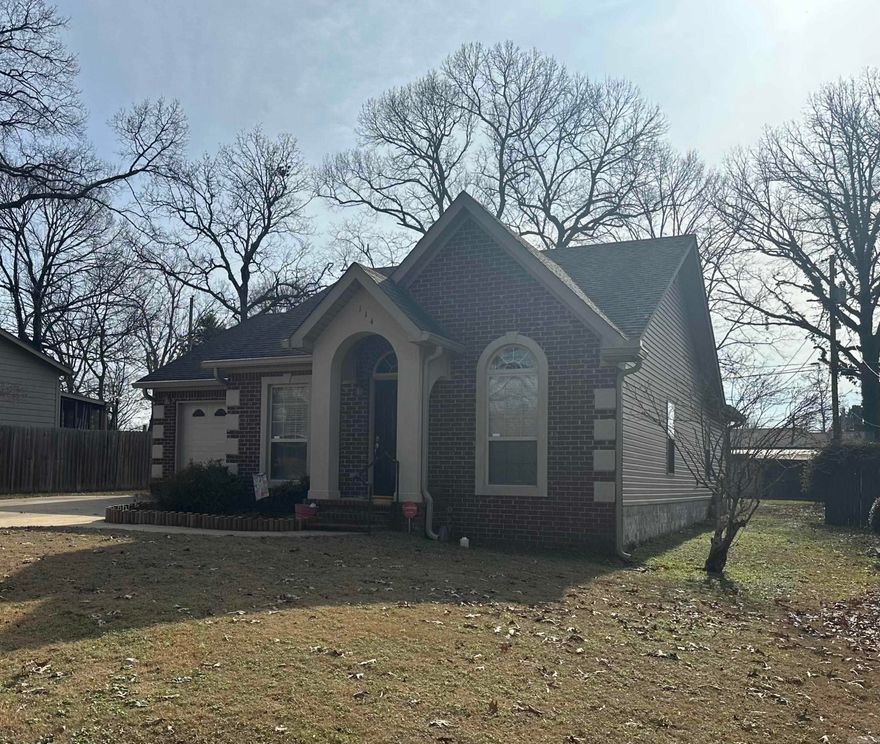 Discover your perfect home!  This charming 3-bedroom, 2-bath residence features sleek smooth tile countertops and beautiful wood floors throughout.  The spacious master bath offers a relaxing walk-in tub, providing comfort and convenience.  Outside, enjoy a versatile shed with two doors and a back entrance-ideal for storage or hobbies.  Recent updates include brand-new gutters for added peace of mind as well as an extra parking pad.  Located near top schools, shopping centers, and delicious restaurants, this home combines comfort, functionality, and location.  Don't miss out on this wonderful opportunity-schedule your tour today!