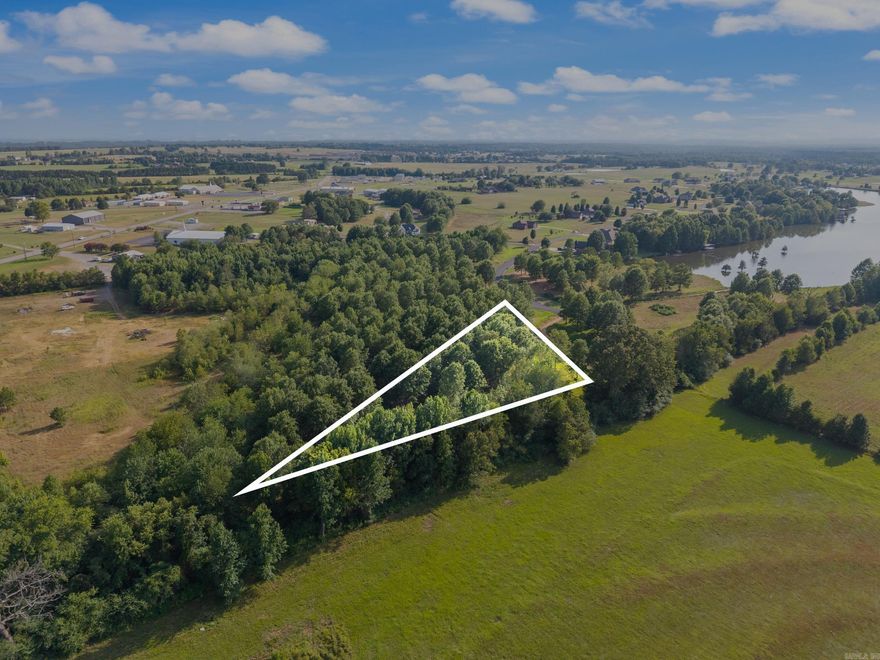 Want to live on one of the best private lakes in Arkansas? Then this is the place for you! This lot is one of the largest available on the newly opened up, Phase 2 of Win Meadow Lake Subdivision. The lot boasts plenty of room to enjoy living with your view of the sun setting across the tranquil Win Meadow Lake. This 55 acre lake offers excellent fishing opportunities and is fully stocked with trophy Largemouth Bass & Crappie. Enjoyment of the lake is limited to residents of the subdivision and their guests. There is a well-maintained boat launch and fishing access available to residents of the lake. Homes built here are subject to a few covenants to maintain a beauty and quality of living found few other places. Come check out this beautiful neighborhood today! Only a limited number of lots are left available to the public so don't expect these to last long.